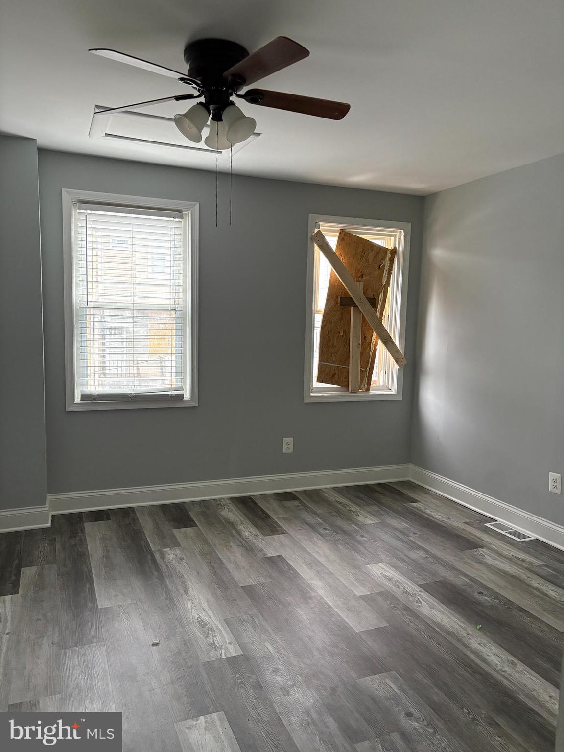 3413 Noble Street Baltimore, MD 21224 - Photo 8 of 43 an empty room with a window and a ceiling fan