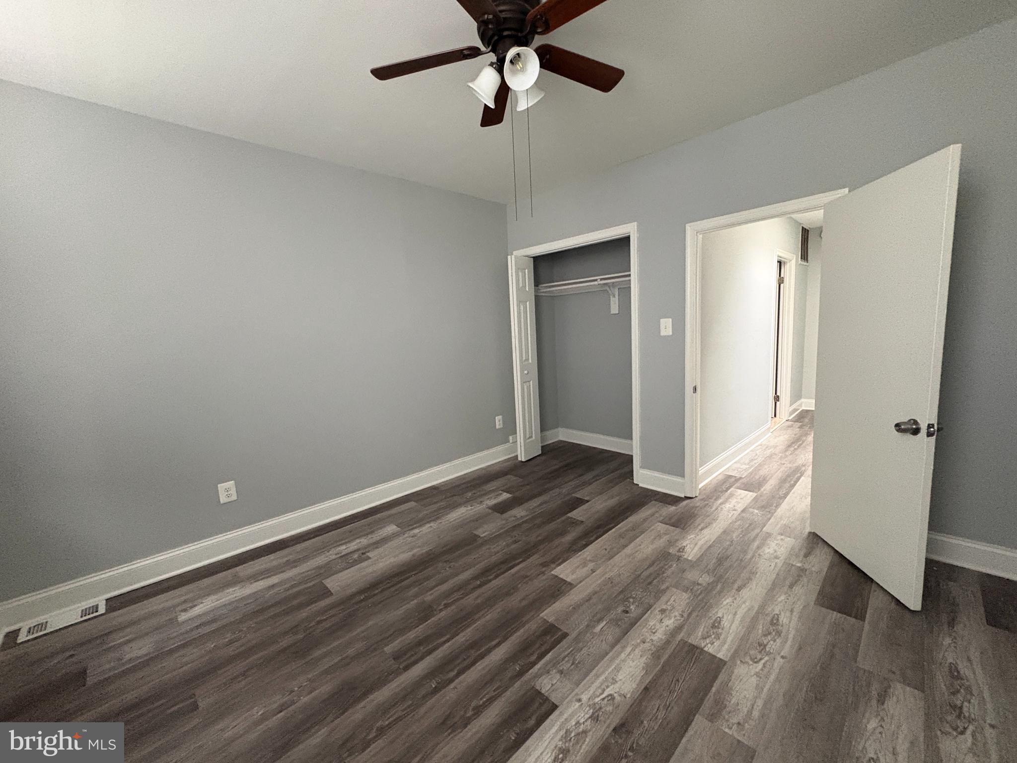 3413 Noble Street Baltimore, MD 21224 - Photo 10 of 43 a view of a room with wooden floor and ceiling fan