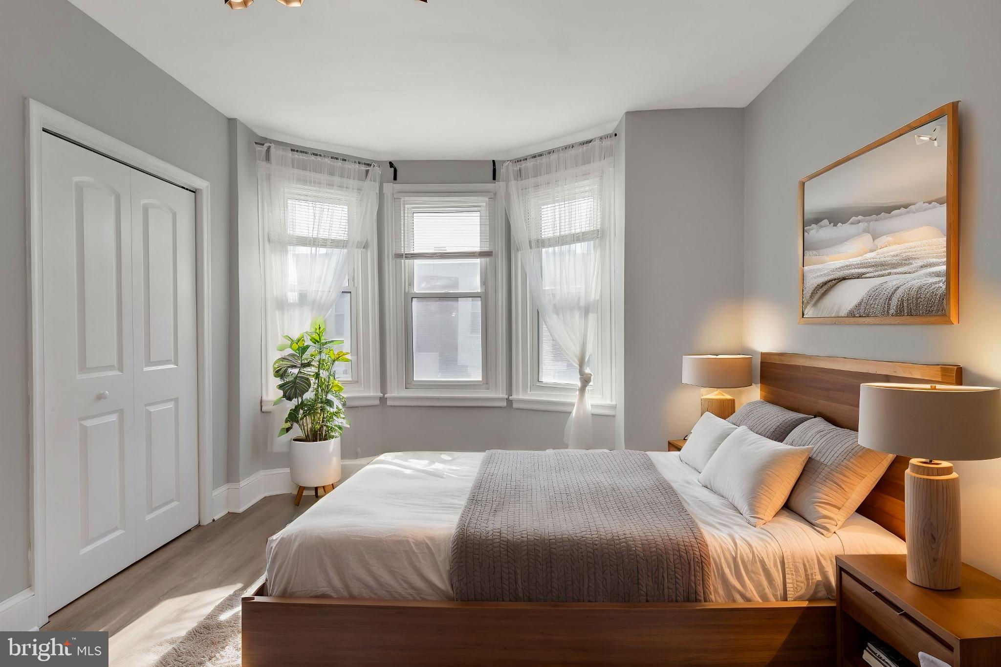 103 Daly Street Philadelphia, PA 19148 - Photo 2 of 23 a bedroom with a bed and a window