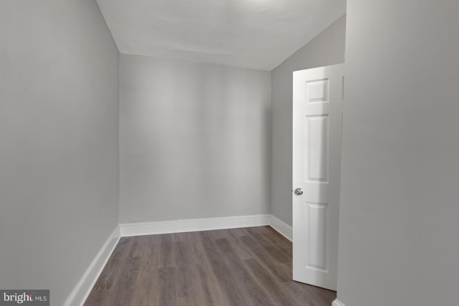 103 Daly Street Philadelphia, PA 19148 - Photo 21 of 23 a view of an empty room with wooden floor