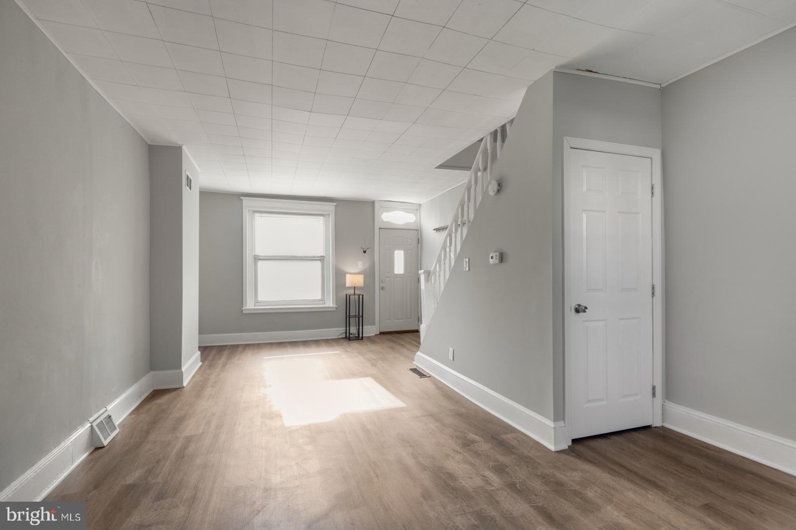 103 Daly Street Philadelphia, PA 19148 - Photo 7 of 23 a view of a big room with wooden floor and windows
