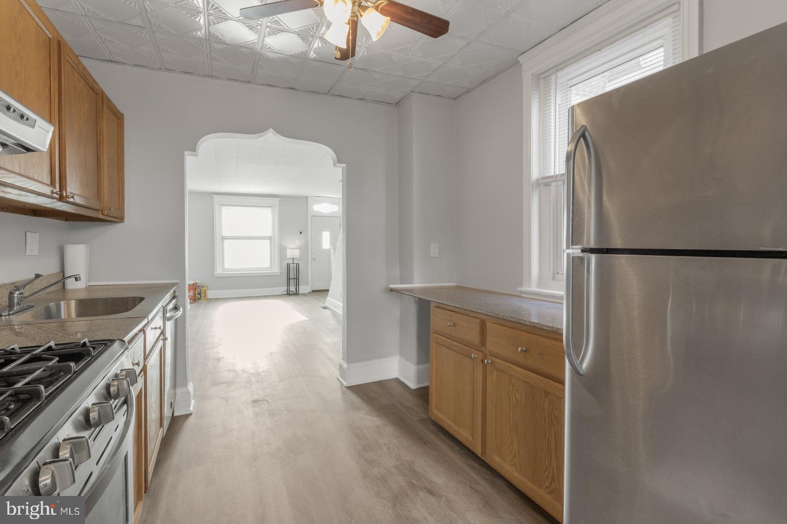 103 Daly Street Philadelphia, PA 19148 - Photo 9 of 23 a kitchen with a refrigerator a stove and a sink