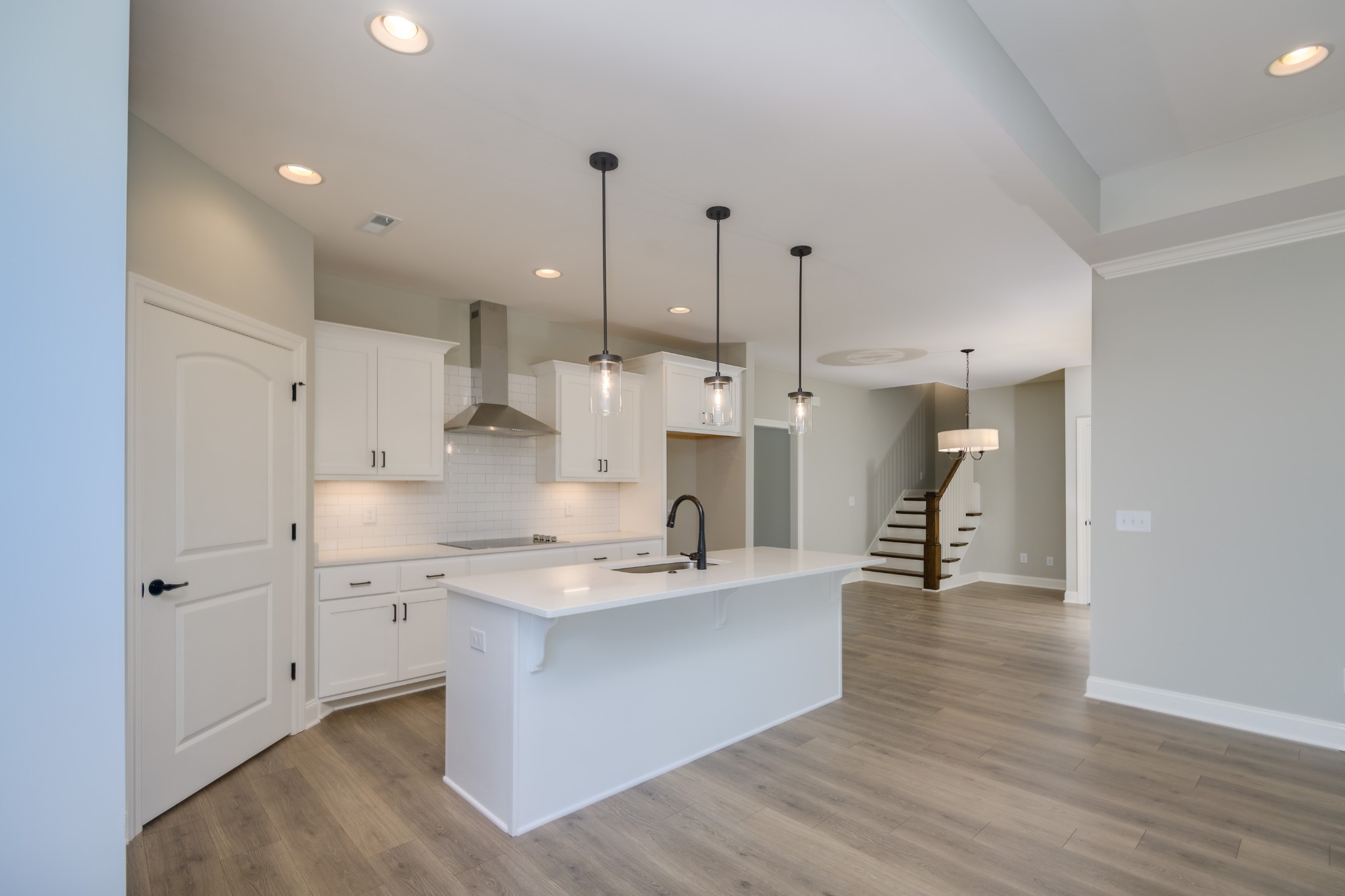 2290 Midland Road, Unit 7A Shelbyville, TN 37160 - Photo 21 of 44 a large kitchen with stainless steel appliances kitchen island granite countertop a sink refrigerator and cabinets