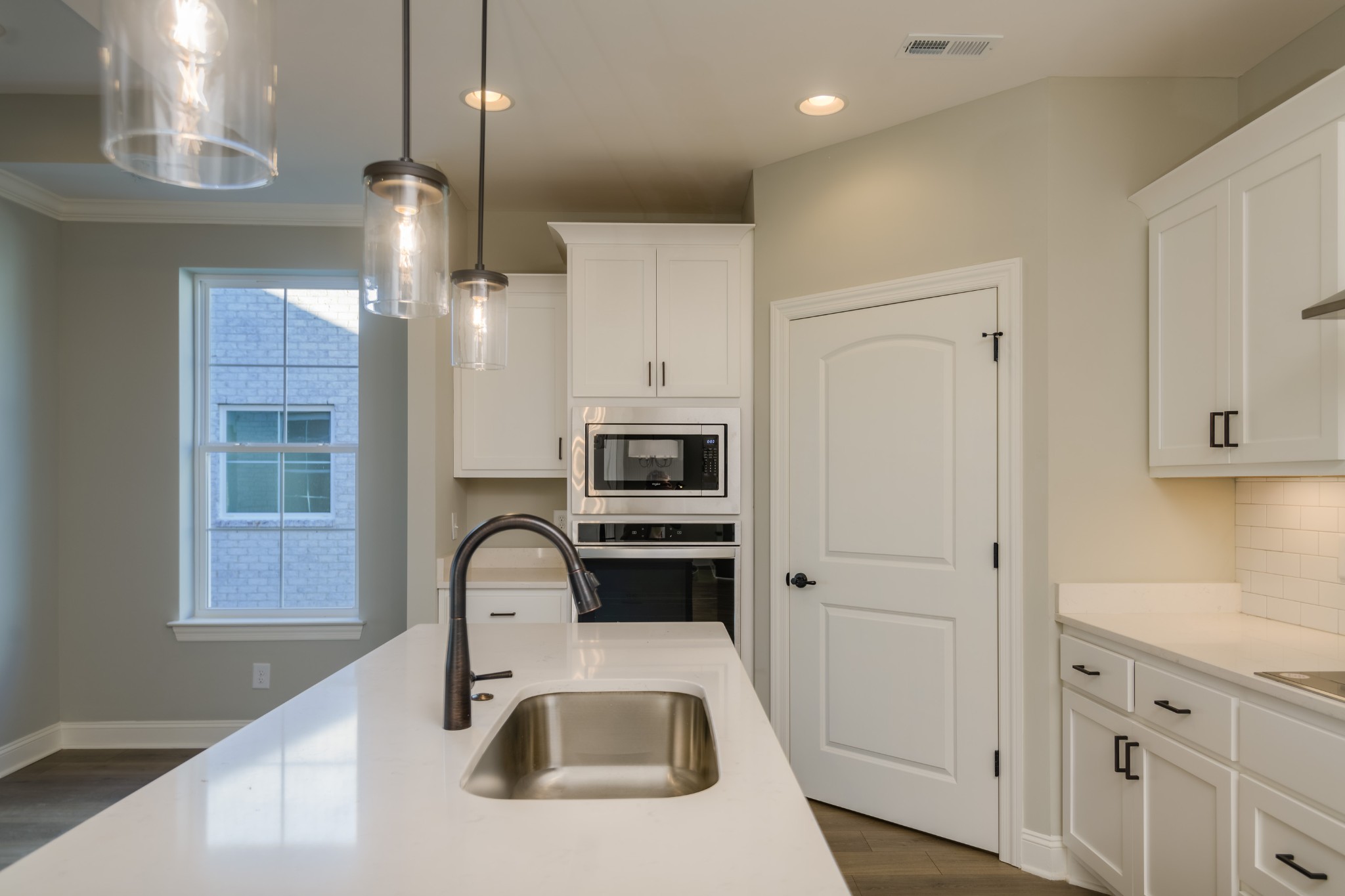 2290 Midland Road, Unit 7A Shelbyville, TN 37160 - Photo 23 of 44 a kitchen with granite countertop a sink and white cabinets