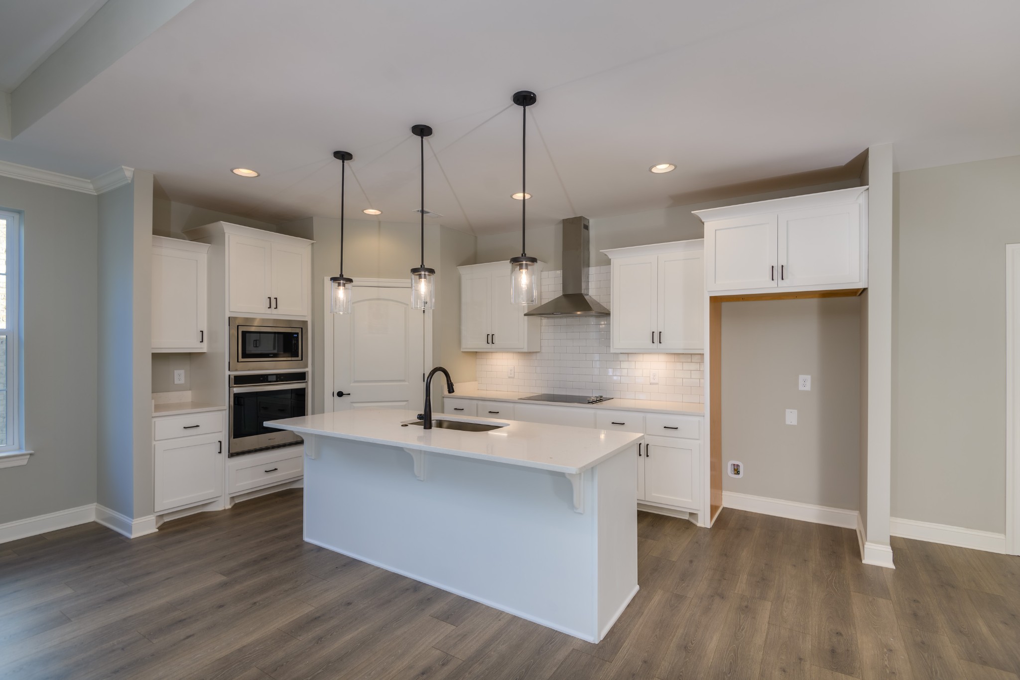 2290 Midland Road, Unit 7A Shelbyville, TN 37160 - Photo 30 of 44 a large kitchen with stainless steel appliances kitchen island a large counter top and a stove top oven