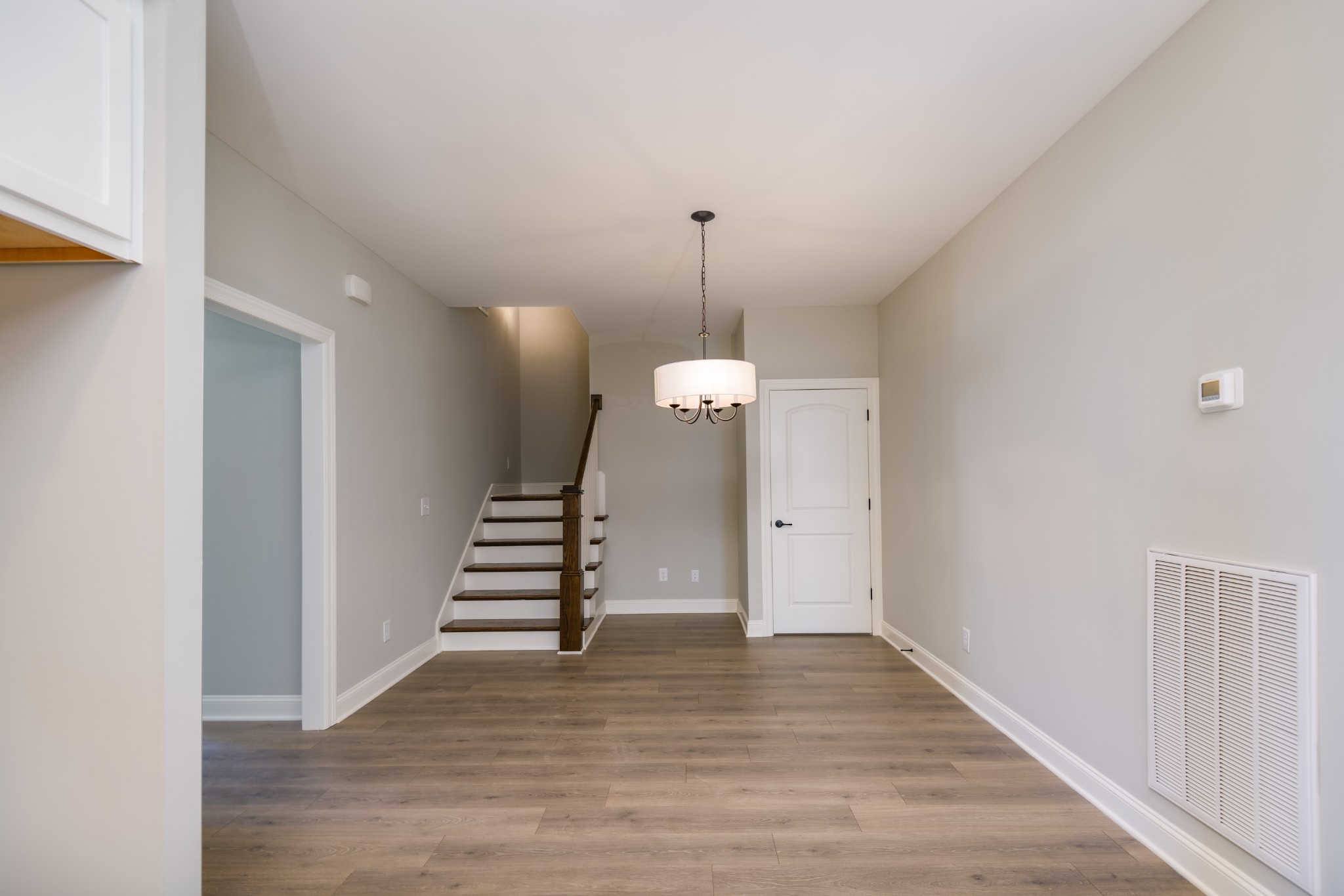 2290 Midland Road, Unit 7A Shelbyville, TN 37160 - Photo 34 of 44 a view of a hallway with stairs and wooden floor