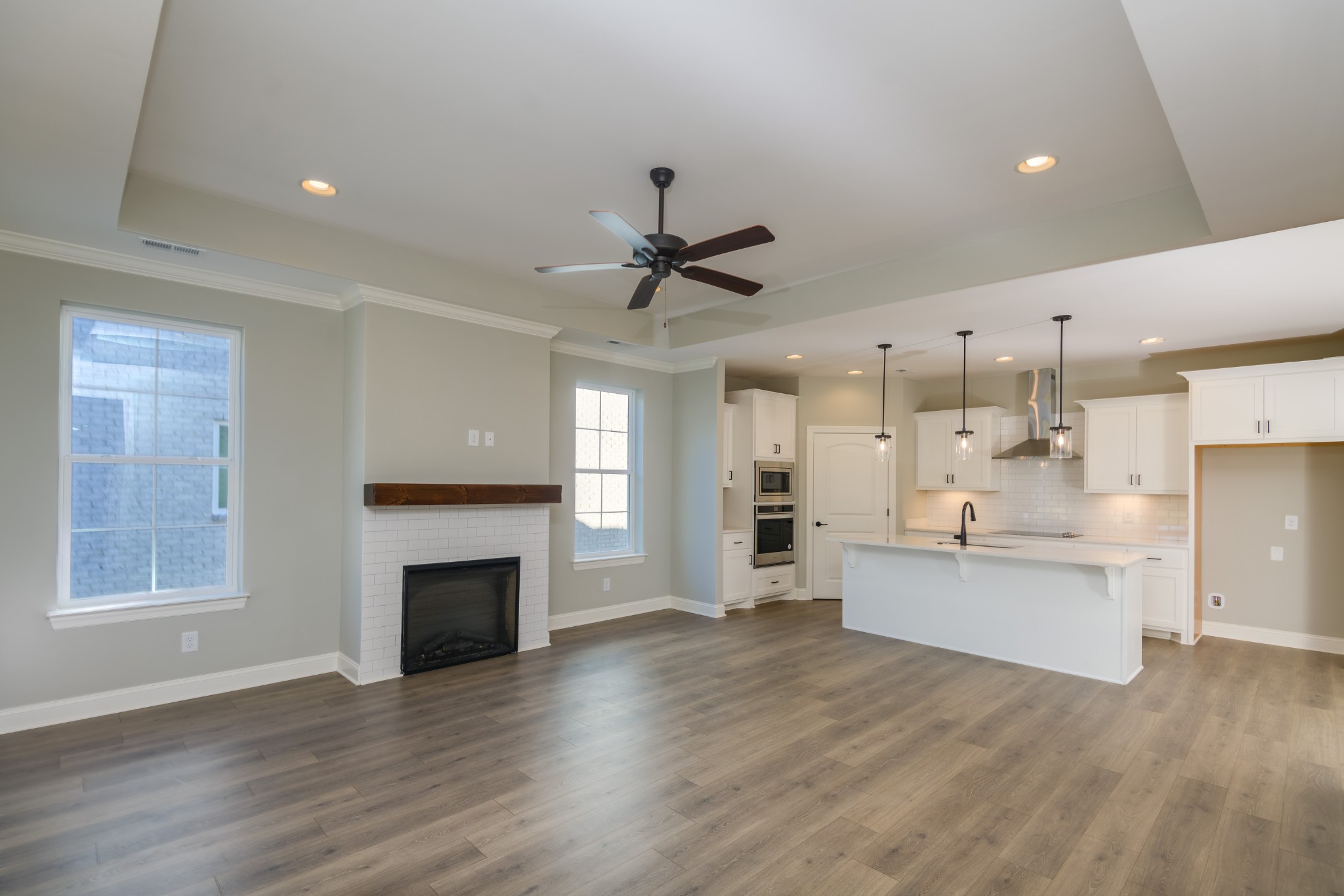 2290 Midland Road, Unit 7A Shelbyville, TN 37160 - Photo 35 of 44 a view of a kitchen with furniture a ceiling fan and wooden floor