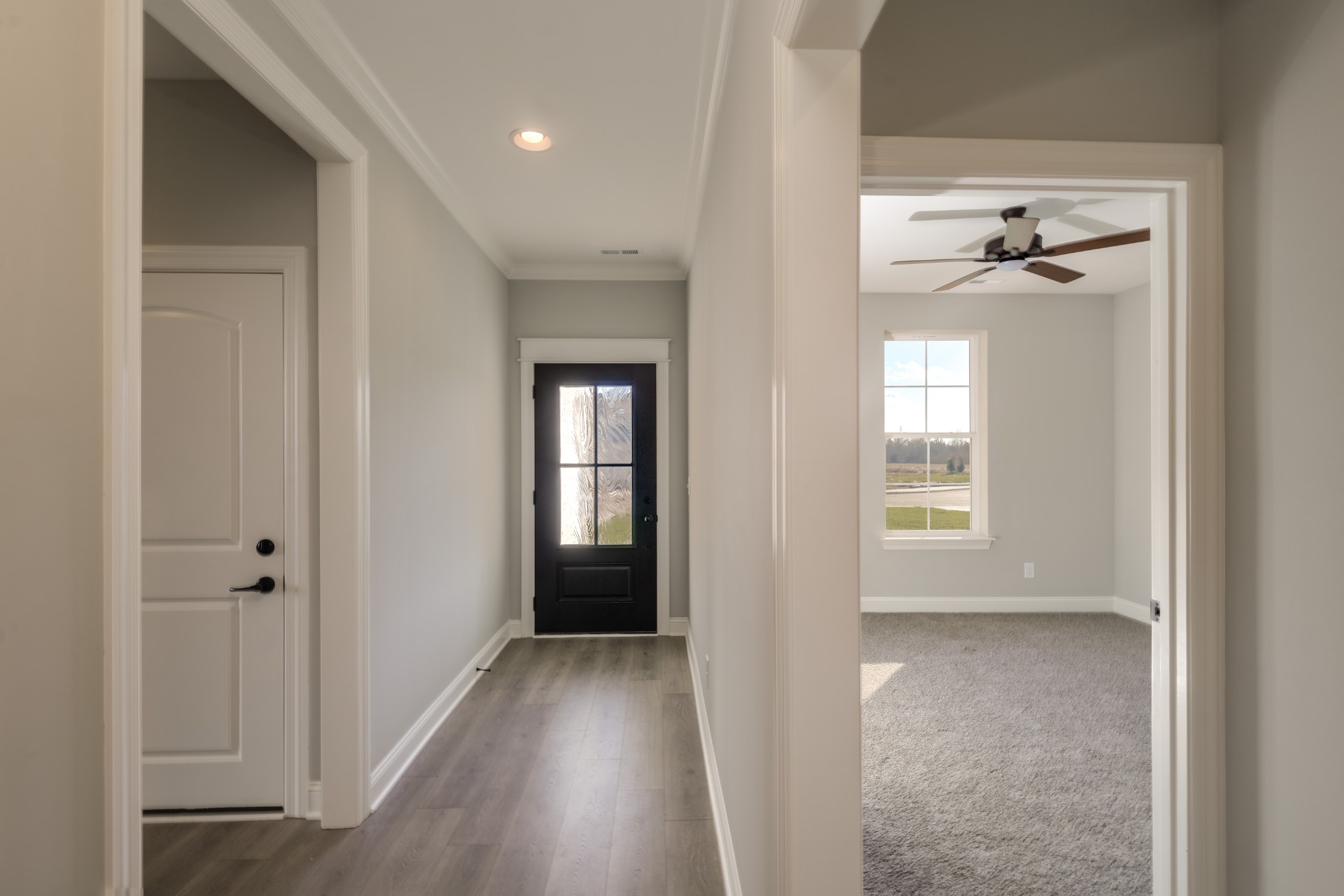 2290 Midland Road, Unit 7A Shelbyville, TN 37160 - Photo 7 of 44 a view of a room with a windows and a ceiling fan
