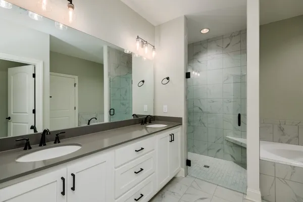a bathroom with a bathtub and a sink