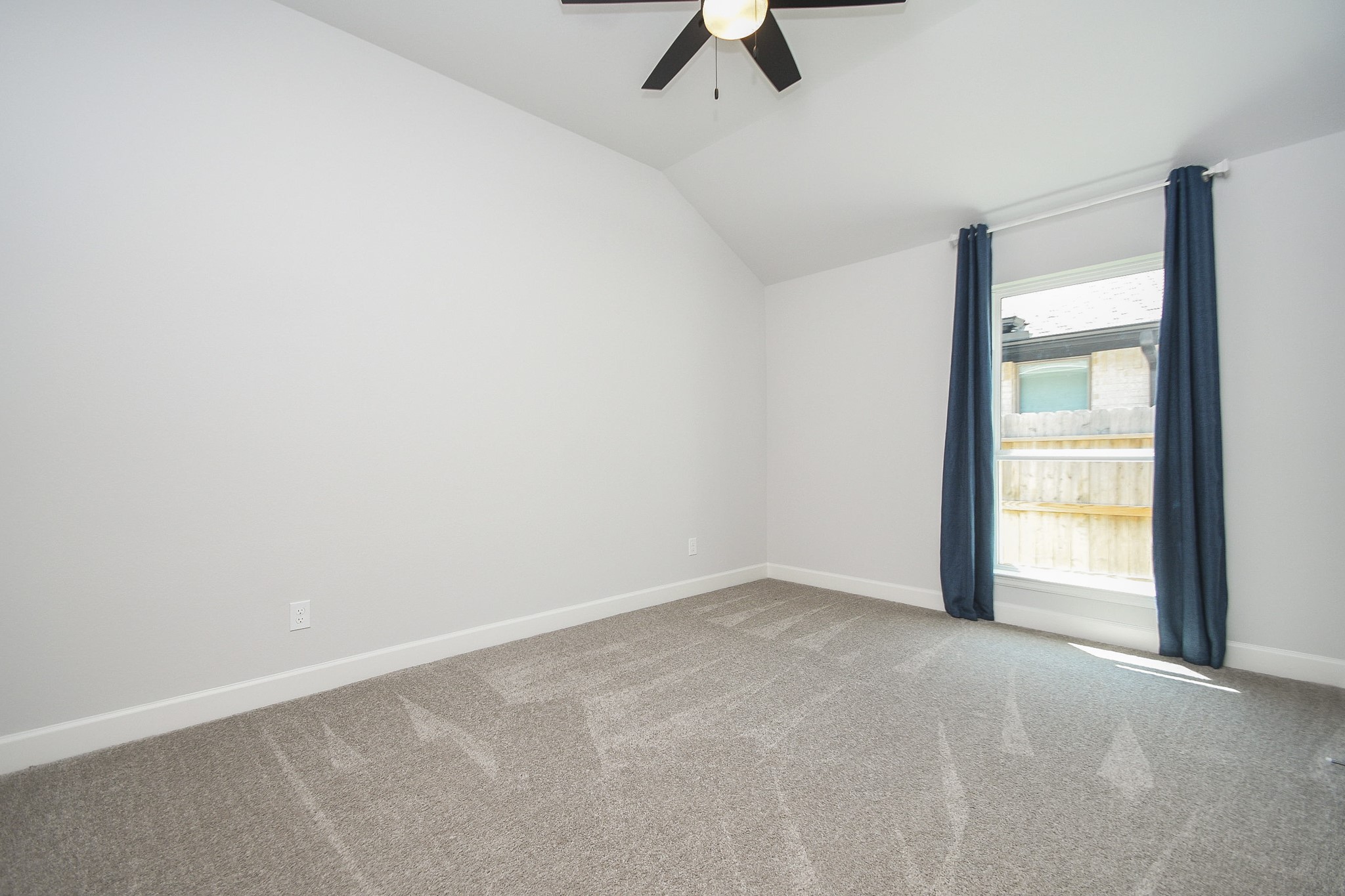 30314 Brook Point Fulshear, TX 77441 - Photo 28 of 38 Third bedroom has vaulted ceiling