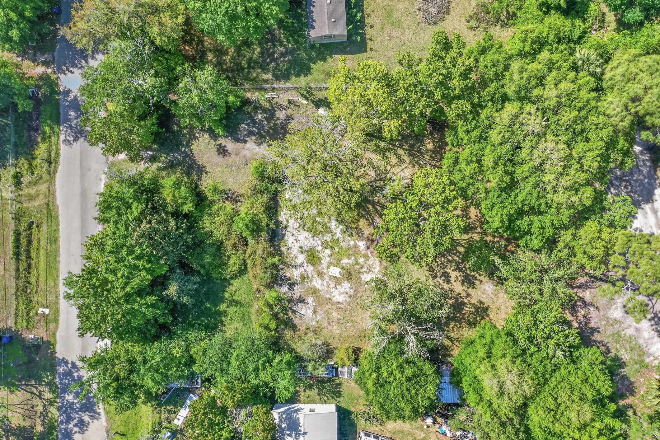 1148 Kerri Lynn Road St. Augustine, FL 32084 - Photo 7 of 35 an aerial view of residential house with outdoor space and trees all around