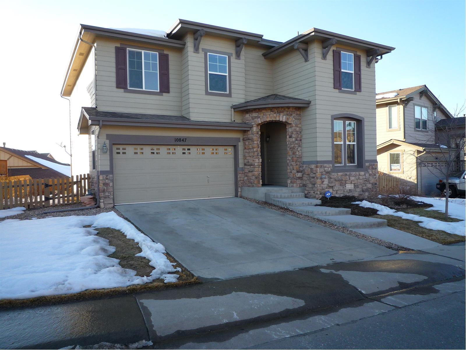a front view of a house with yard