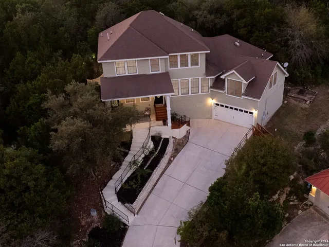 a aerial view of a house with a yard