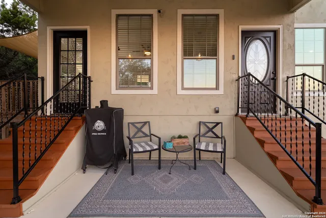 a view of a livingroom with furniture and staircase