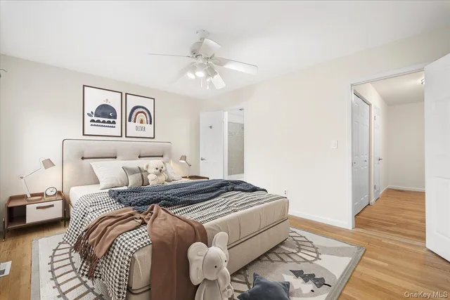 a bedroom with bed and a window