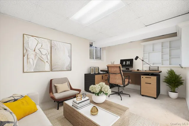 a living room with furniture and piano table