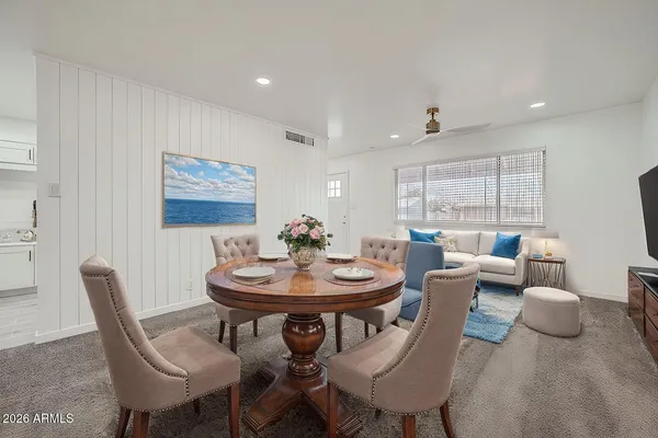 a view of a dining room with furniture and window