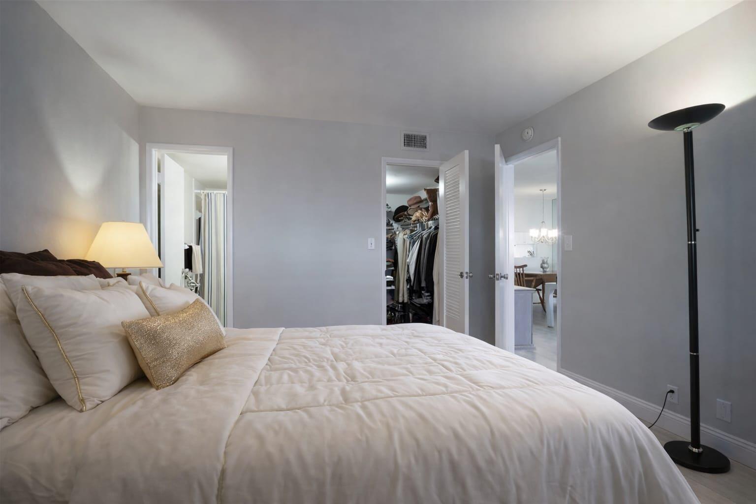 4500 North Federal Highway, Unit 121C Lighthouse Point, FL 33064 - Photo 11 of 14 a bed room with a bed and a mirror