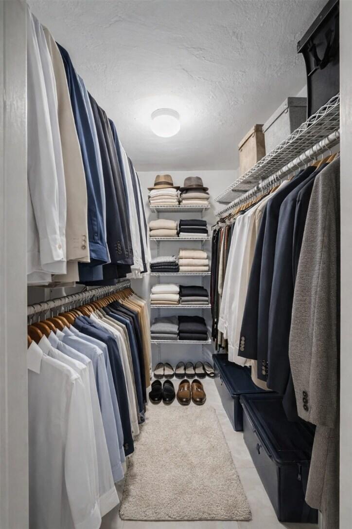 4500 North Federal Highway, Unit 121C Lighthouse Point, FL 33064 - Photo 9 of 14 a view of walk in closet with clothes and shoes