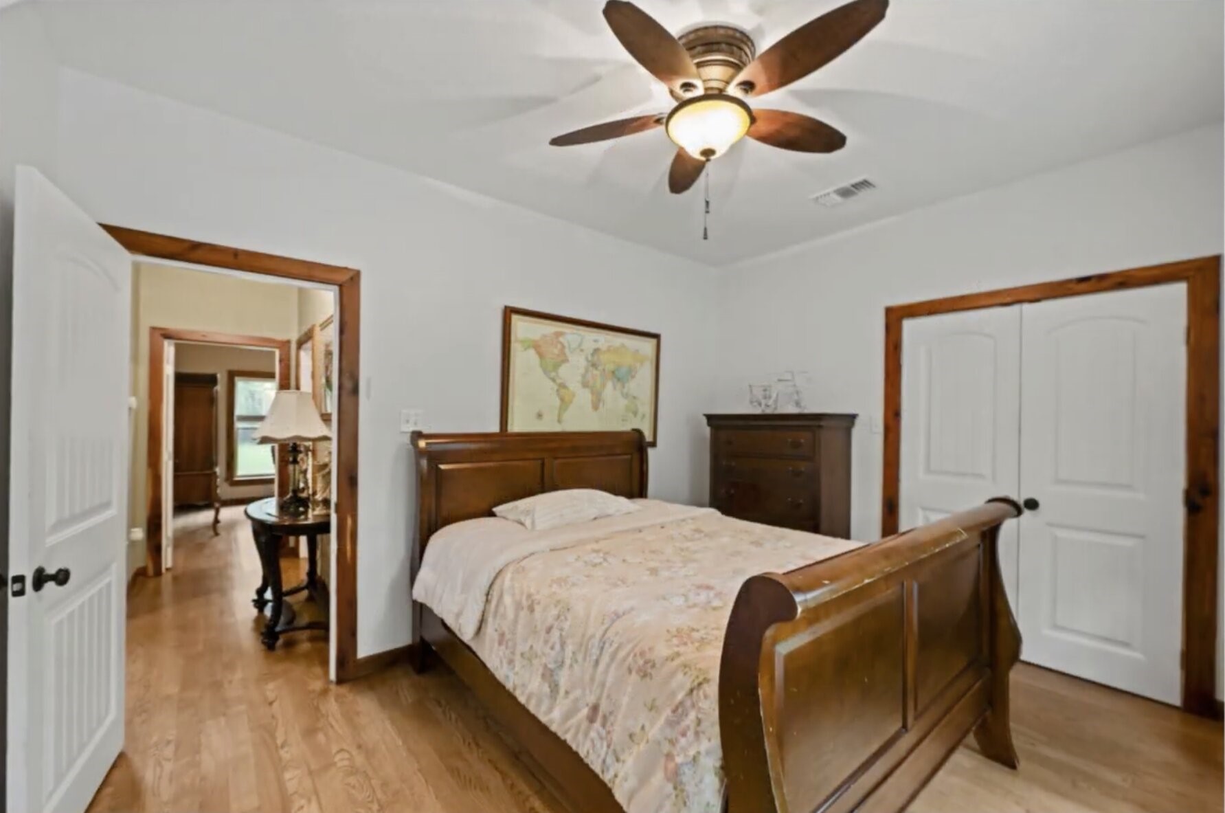 30338 Riley Road Waller, TX 77484 - Photo 27 of 46 a bedroom with a bed and a chandelier