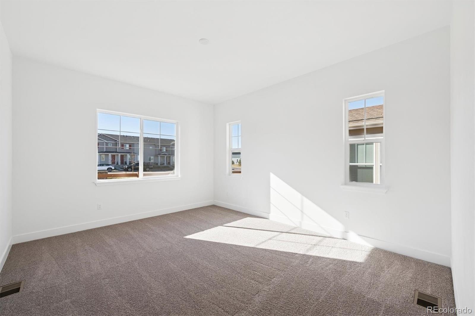 1242 Summit Rise Drive Erie, CO 80516 - Photo 15 of 25 a view of an empty room with a window