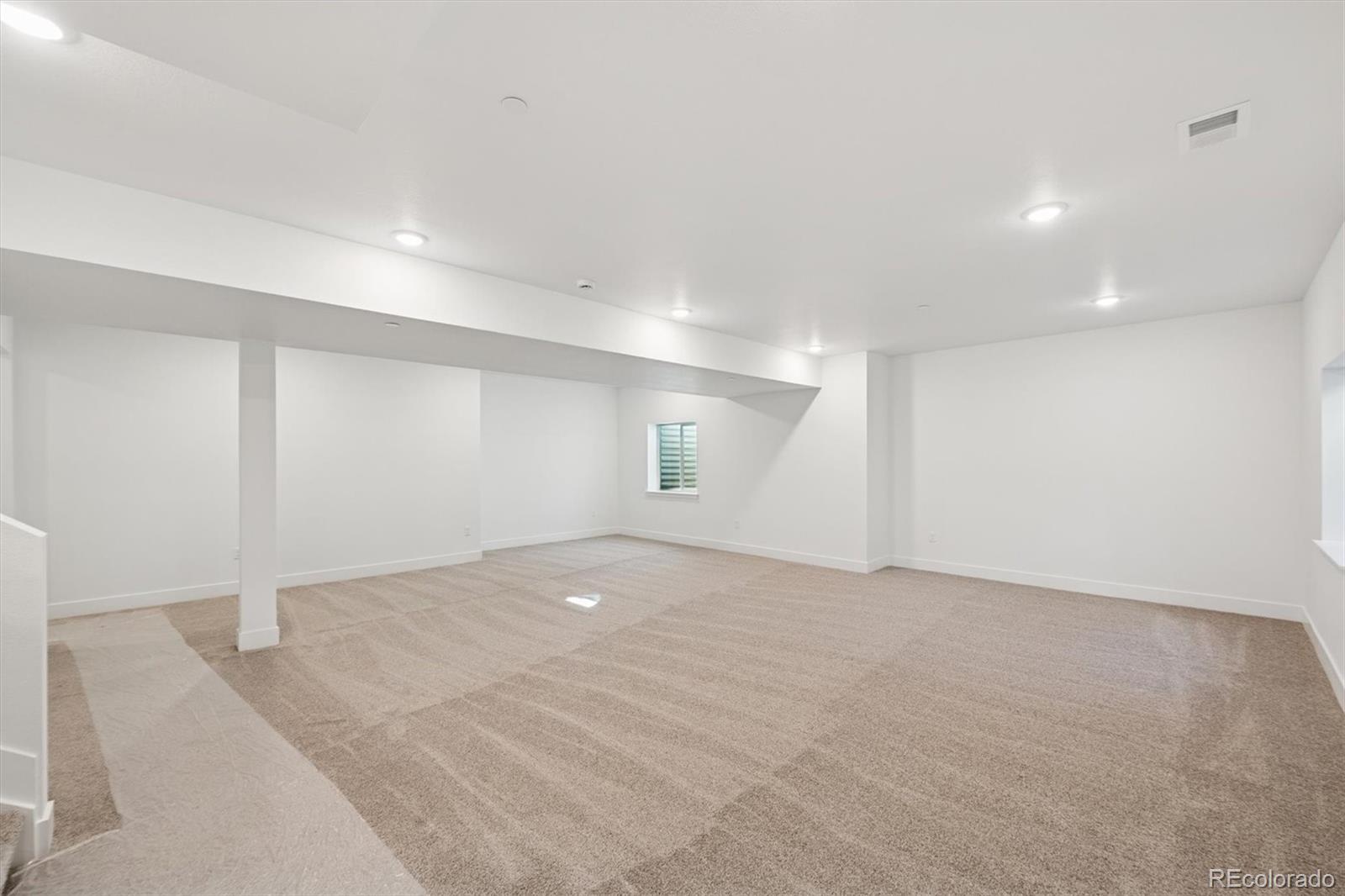1242 Summit Rise Drive Erie, CO 80516 - Photo 19 of 25 an empty room with an entryway