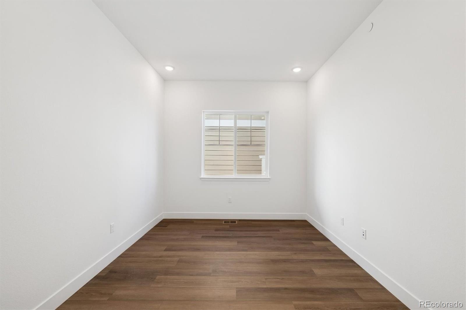 1242 Summit Rise Drive Erie, CO 80516 - Photo 5 of 25 a view of empty room with wooden floor and fan