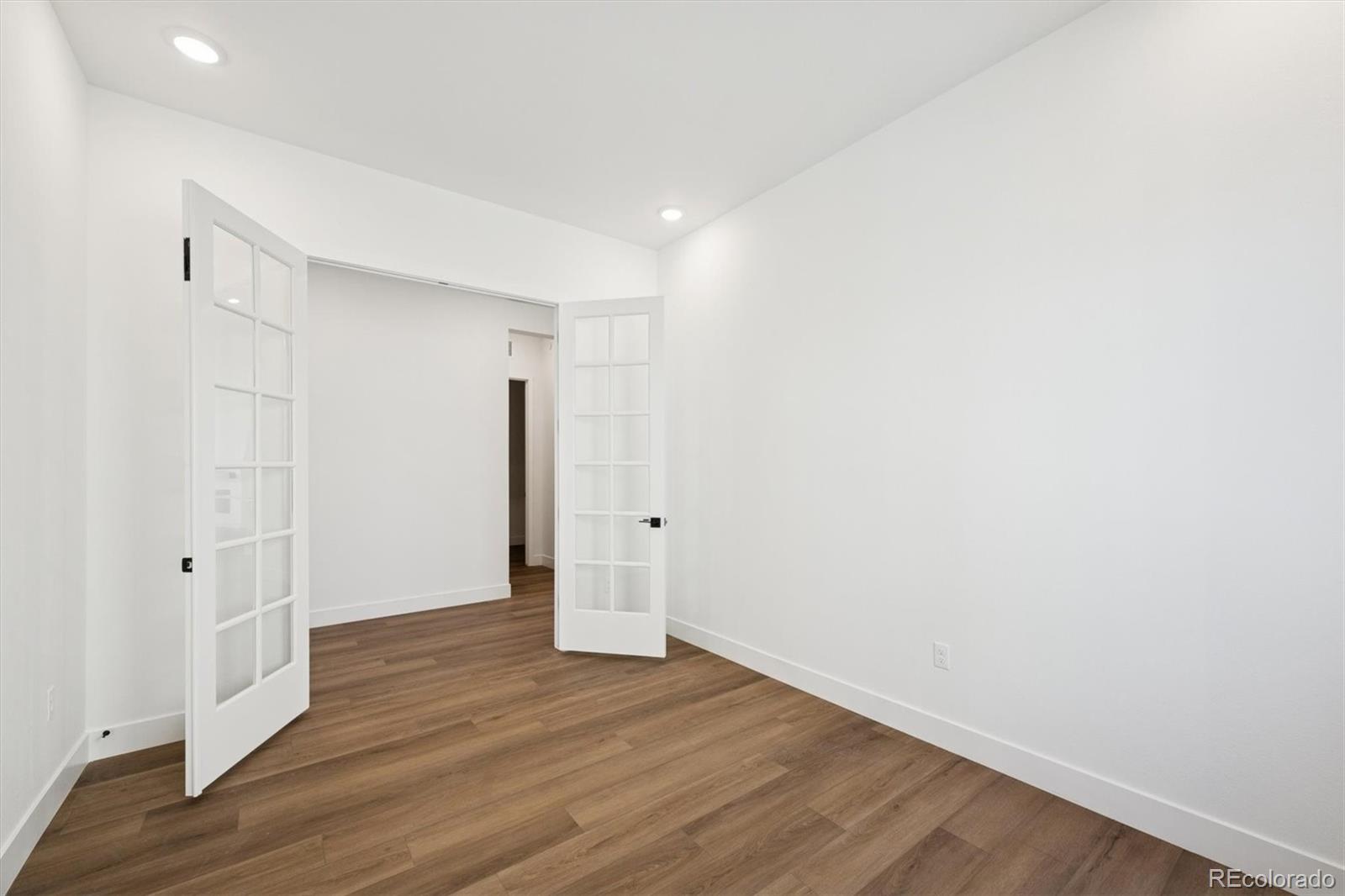1242 Summit Rise Drive Erie, CO 80516 - Photo 6 of 25 a view of an empty room with wooden floor