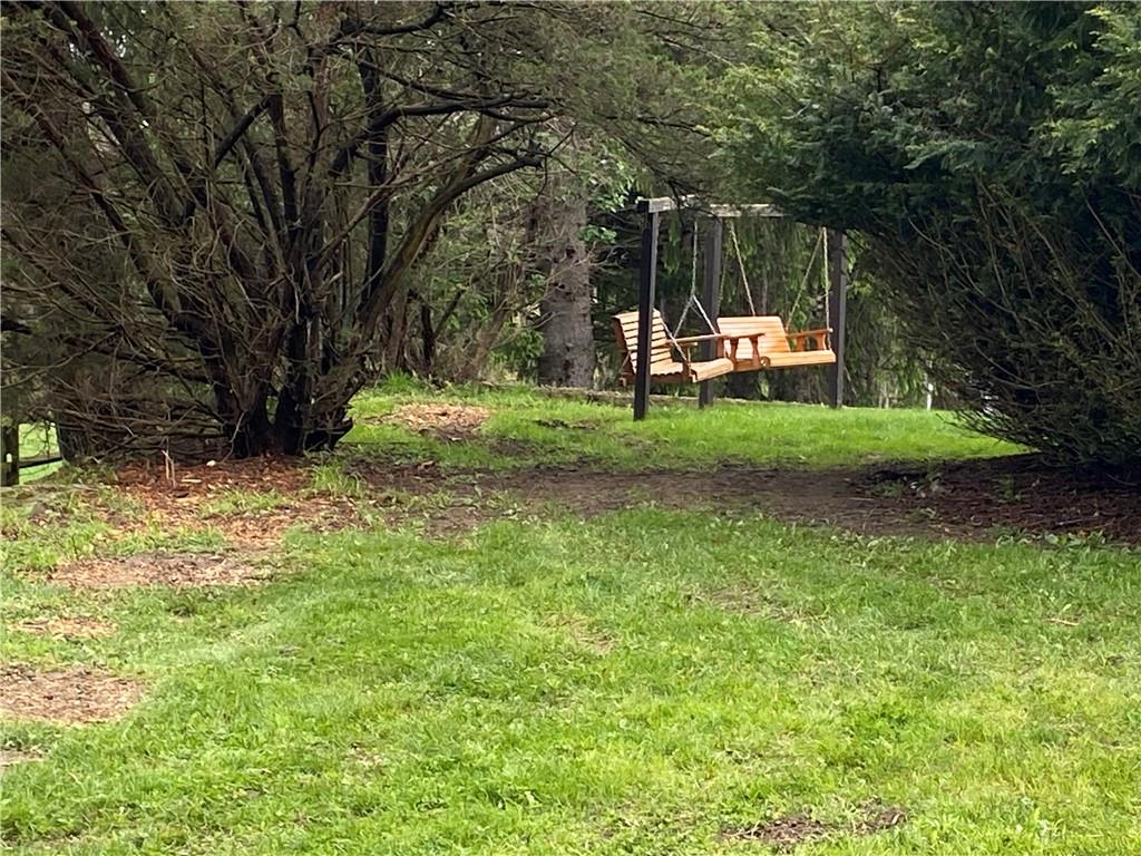 147 Warren Road Franklin, PA 16323 - Photo 11 of 40 a view of backyard with wooden fence and a large tree