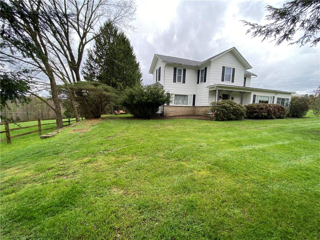 147 Warren Road Franklin, PA 16323 - Photo 12 of 40 a view of a house with a big yard and large trees