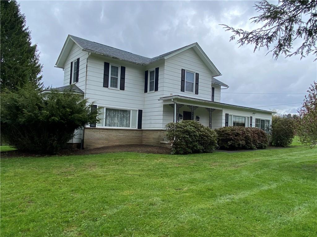147 Warren Road Franklin, PA 16323 - Photo 13 of 40 a front view of a house with a garden
