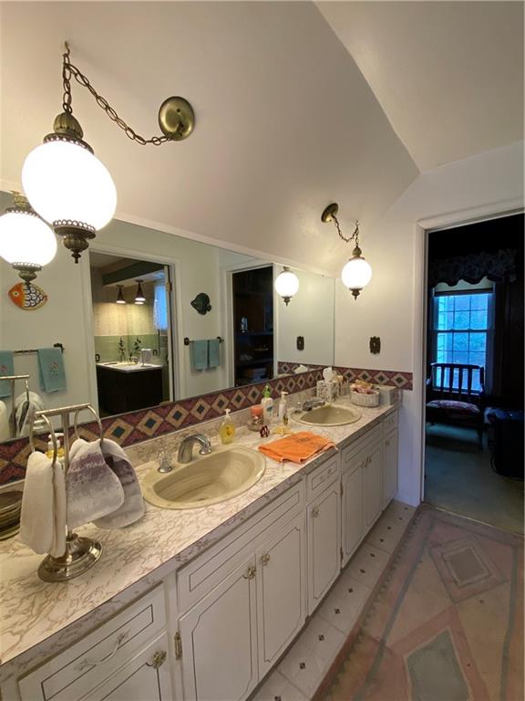 147 Warren Road Franklin, PA 16323 - Photo 20 of 40 a bathroom with a granite countertop sink and a mirror