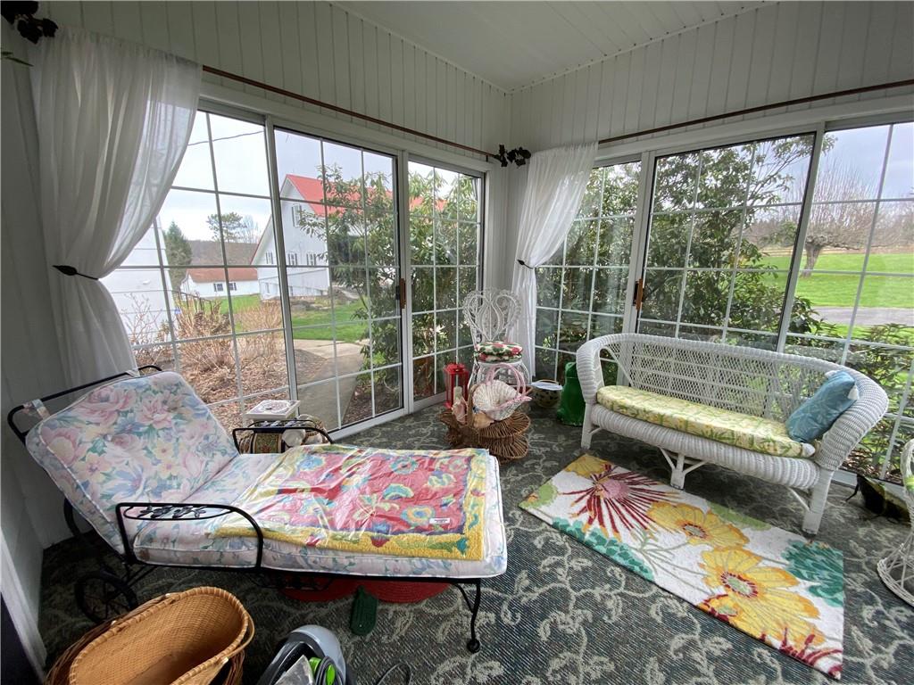 147 Warren Road Franklin, PA 16323 - Photo 26 of 40 a living room with furniture and a floor to ceiling window