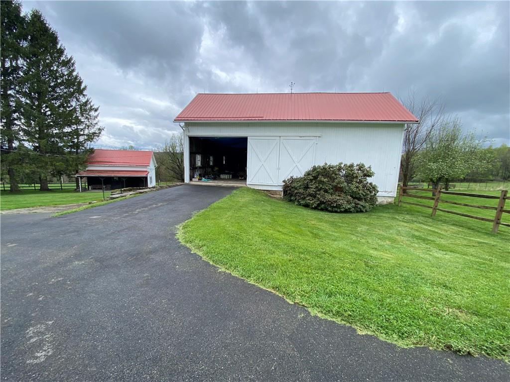 147 Warren Road Franklin, PA 16323 - Photo 6 of 40 a front view of a house with a garden