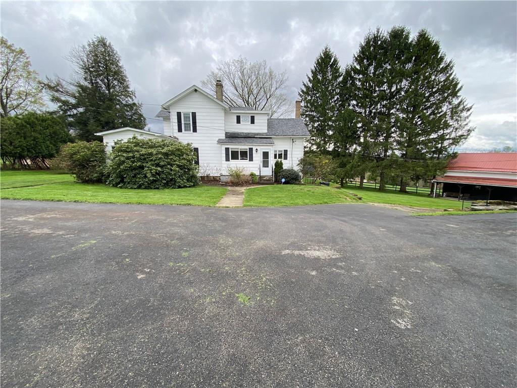 147 Warren Road Franklin, PA 16323 - Photo 7 of 40 a view of a house with a yard and large trees