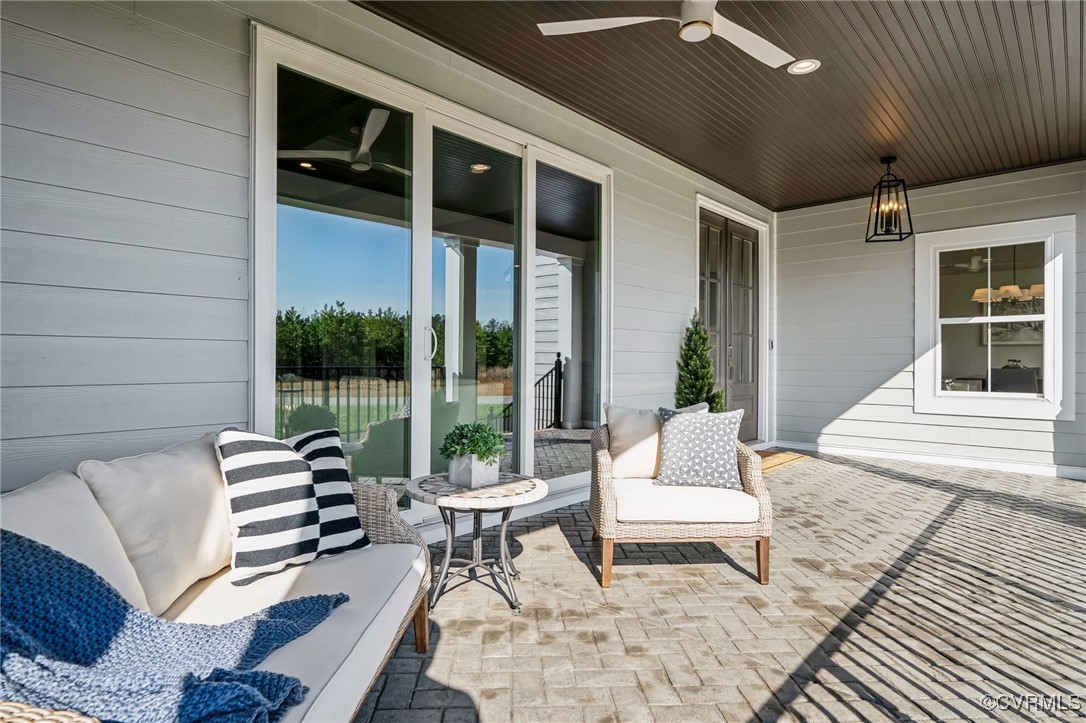 16873 Watchman Way Beaverdam, VA 23015 - Photo 31 of 40 a outdoor living space with furniture and a rug