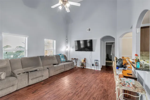 a living room with furniture fireplace and flat screen tv