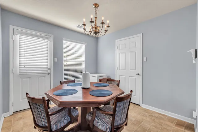 a view of a dining room with furniture and window