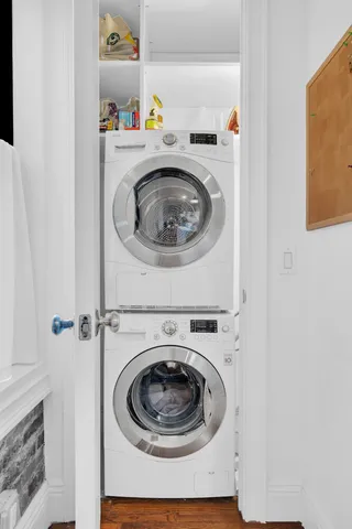 a bathroom with a sink a toilet a mirror and shower