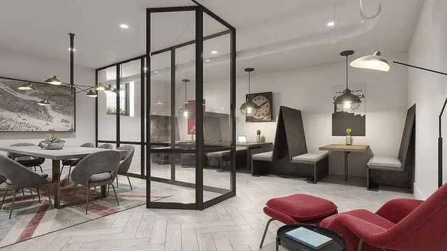 a living room with lots of furniture and a dining table with kitchen view