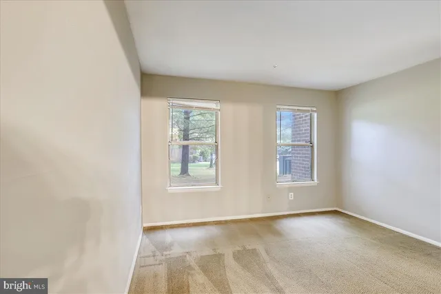 an empty room with windows