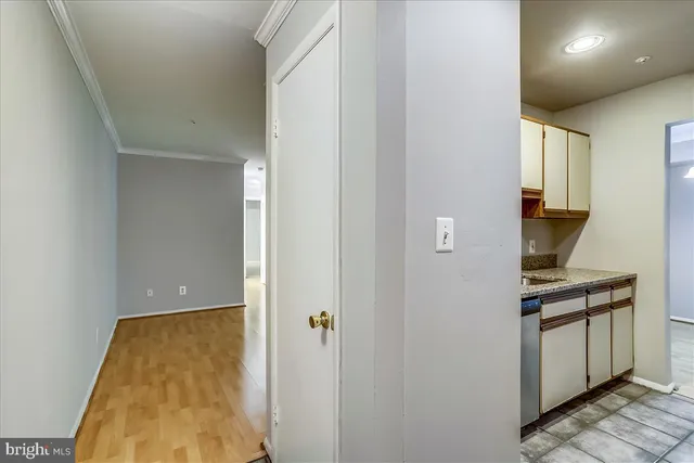a view of kitchen with cabinets and wooden floor