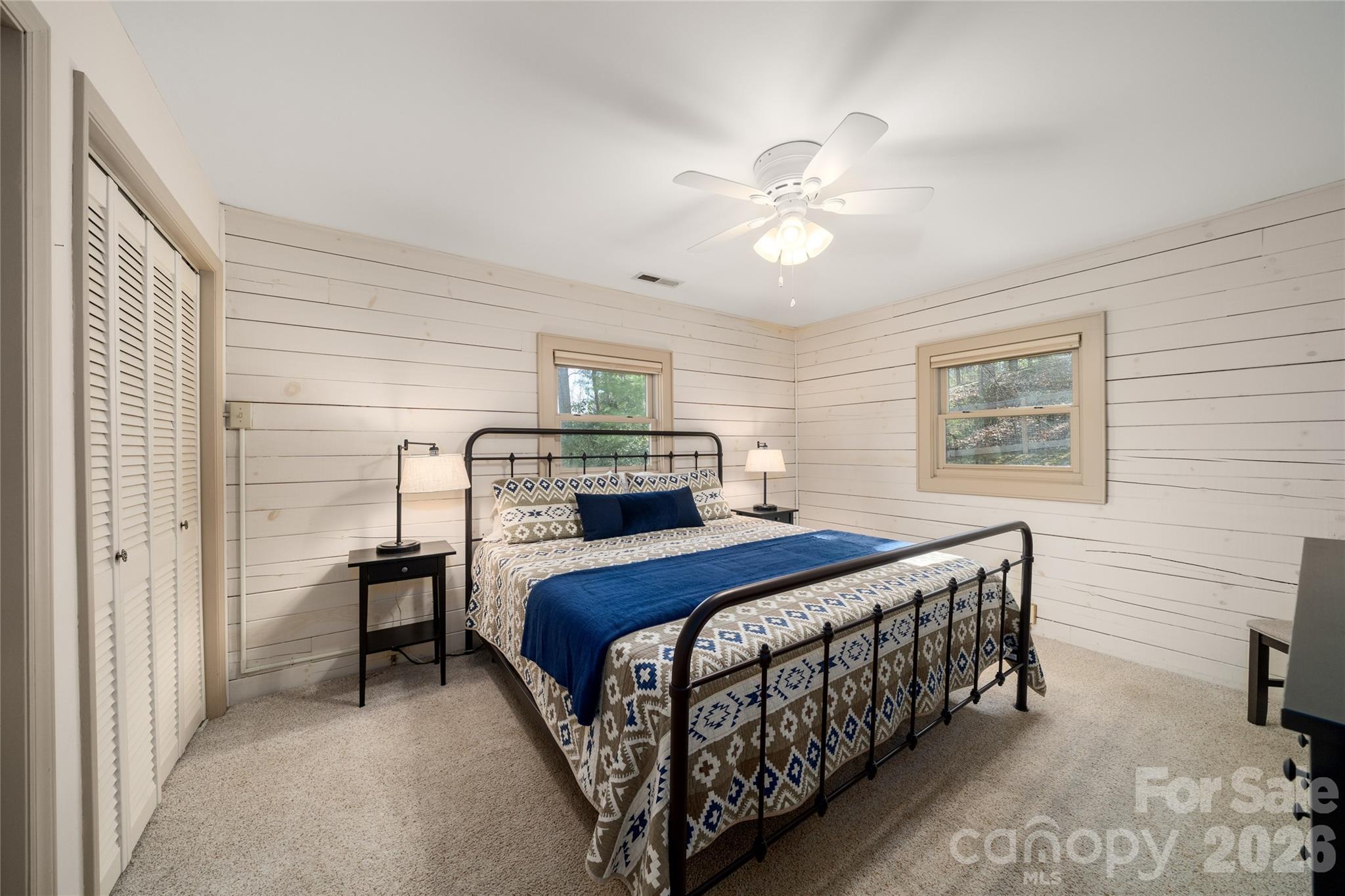 37 Cherokee Trail Fletcher, NC 28732 - Photo 11 of 34 a bedroom with a bed and a chandelier