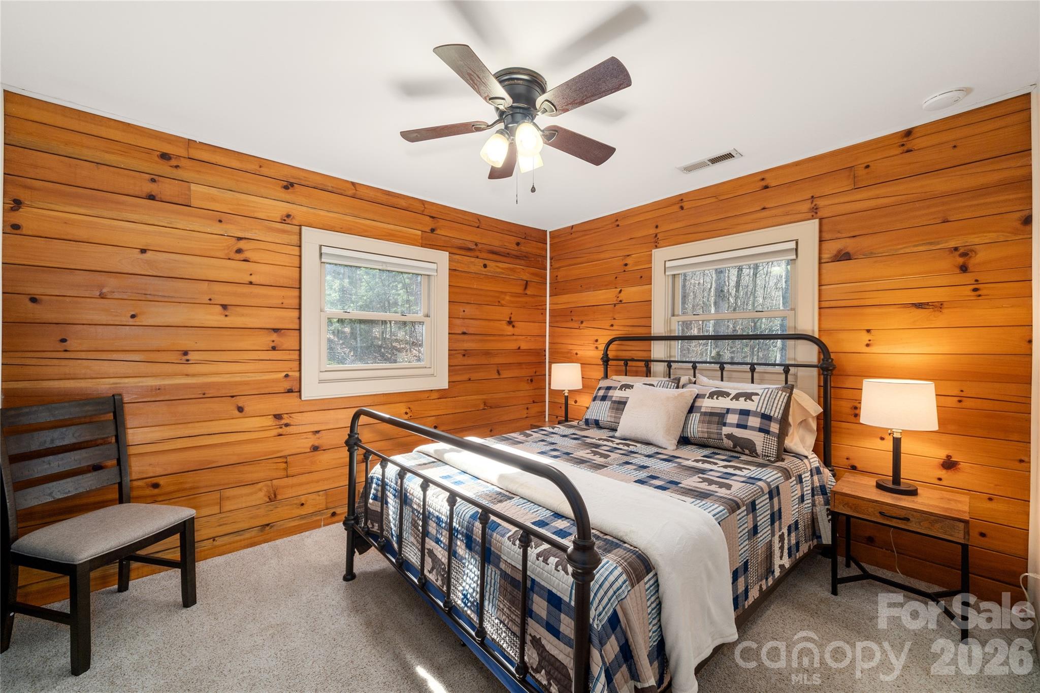 37 Cherokee Trail Fletcher, NC 28732 - Photo 14 of 34 a bedroom with a bed and a chandelier