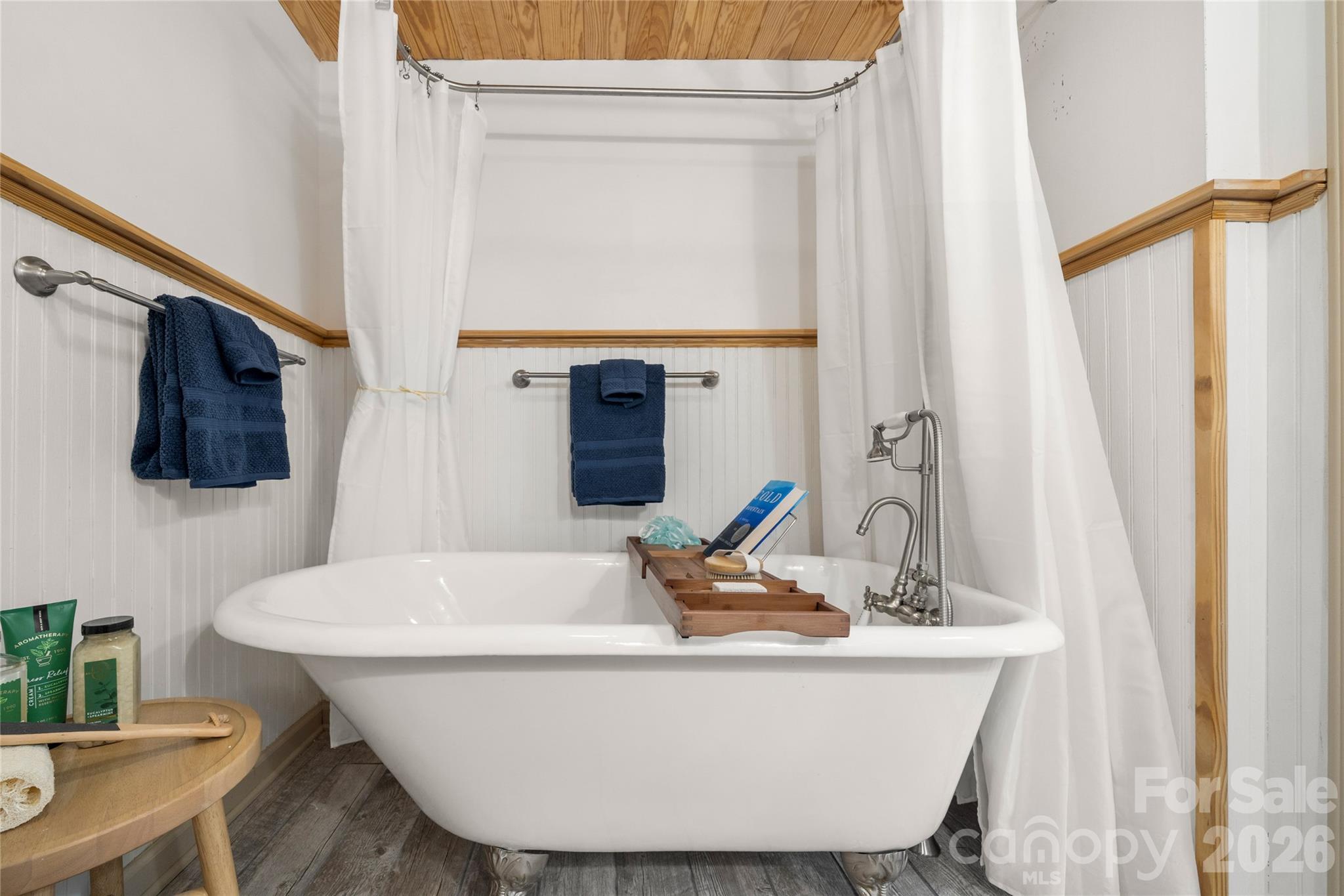 37 Cherokee Trail Fletcher, NC 28732 - Photo 23 of 34 a white bath tub sitting next to a white sink and a window