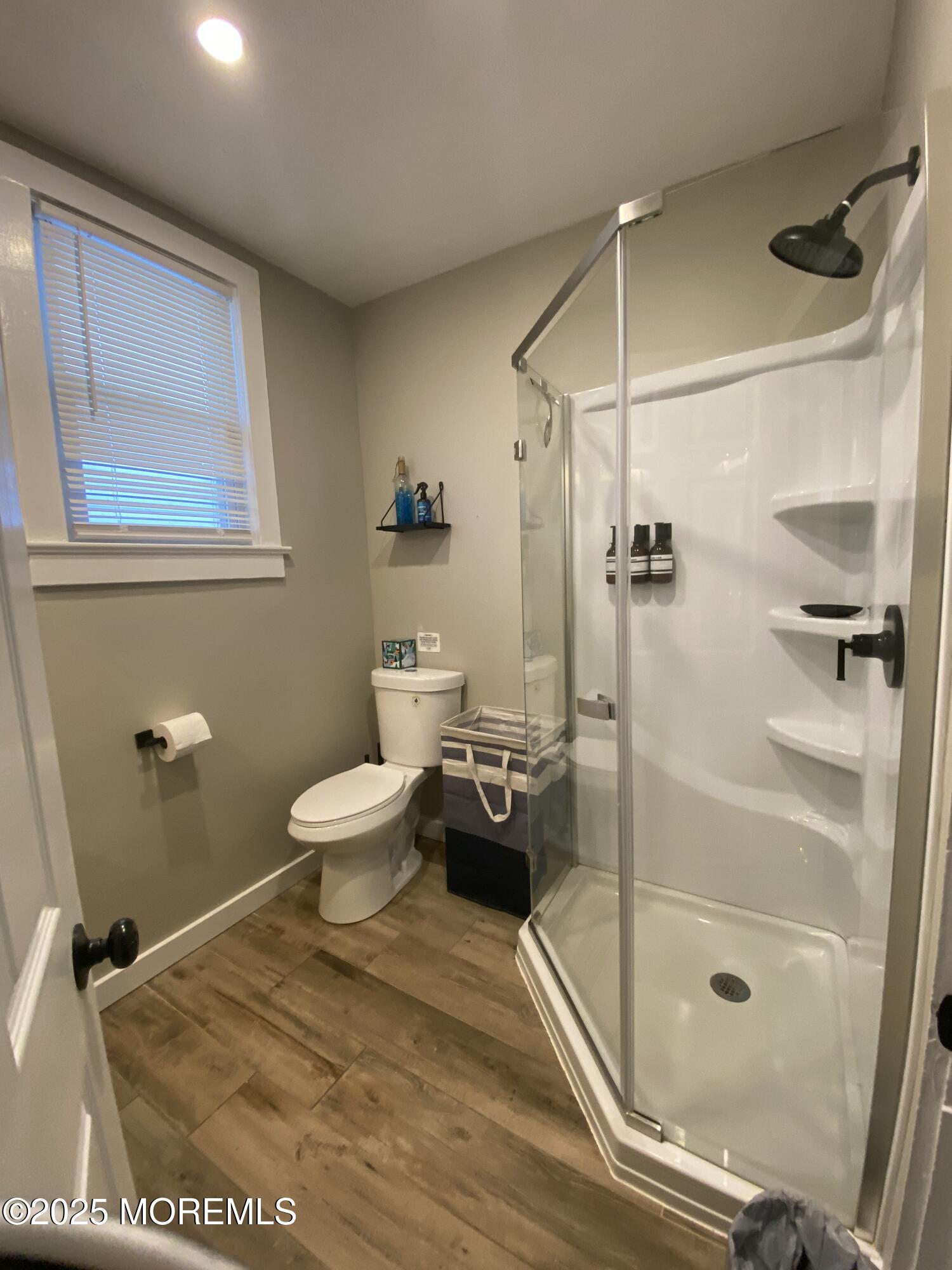 215 Webster Avenue, Unit 2 Seaside Heights, NJ 08751 - Photo 4 of 10 a bathroom with a toilet and a shower