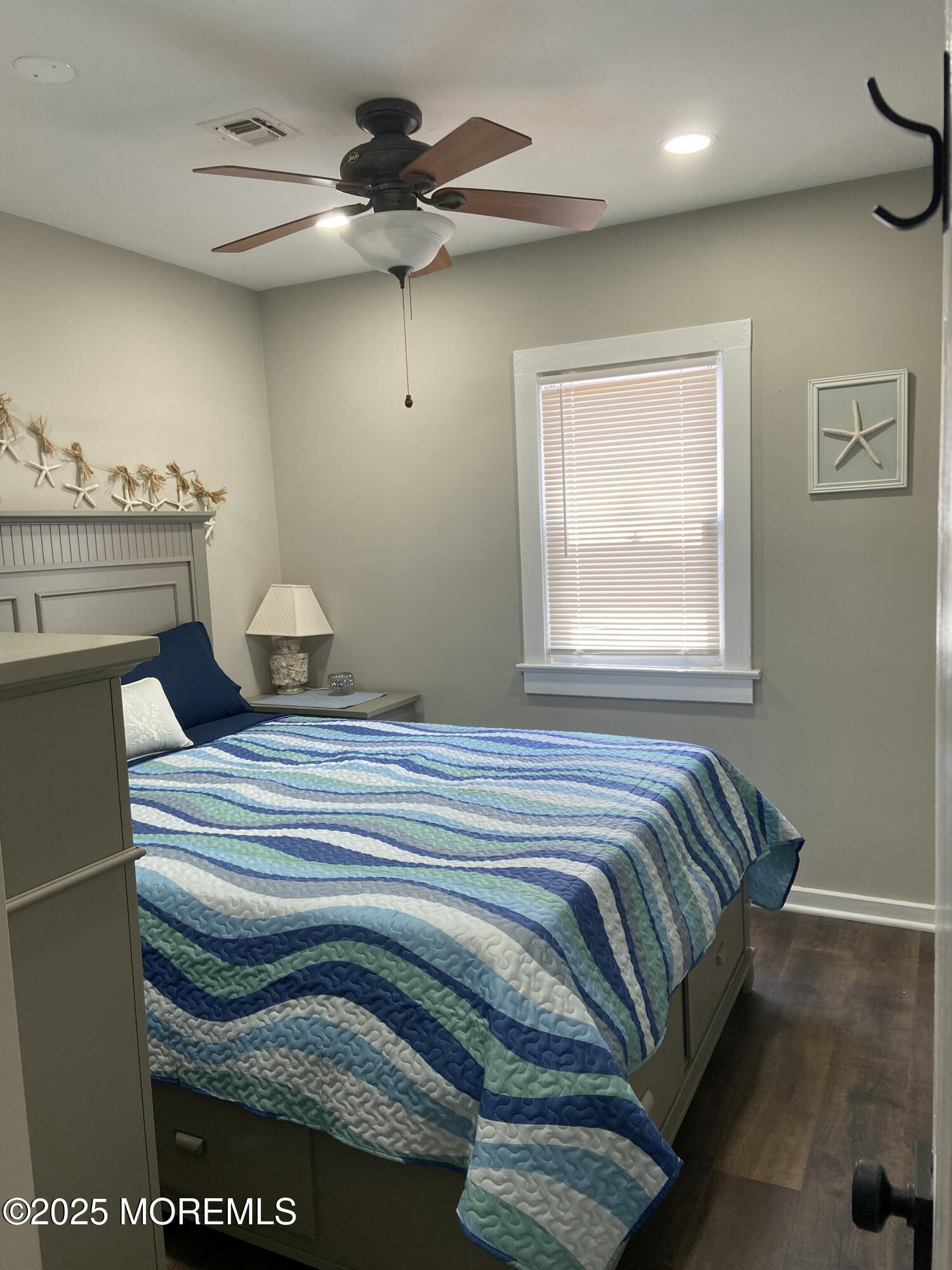 215 Webster Avenue, Unit 2 Seaside Heights, NJ 08751 - Photo 8 of 10 a bedroom with a bed and a window