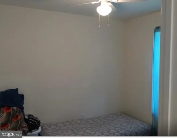 a backyard of a house with plants and trees