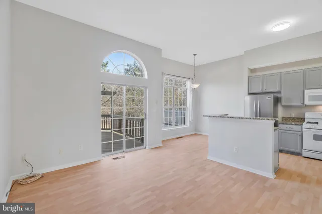 a view of a kitchen with a sink dishwasher and a refrigerator