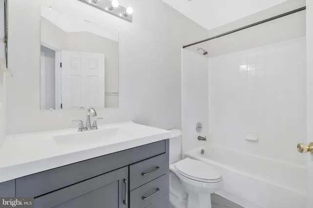 a bathroom with a sink a toilet and a bathtub